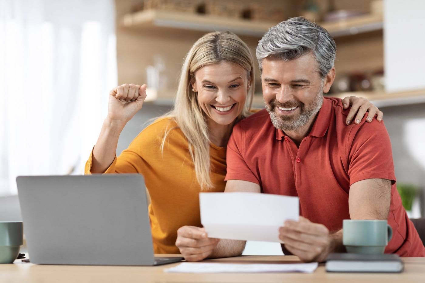 Couple reviewing home equity options together at their kitchen table.