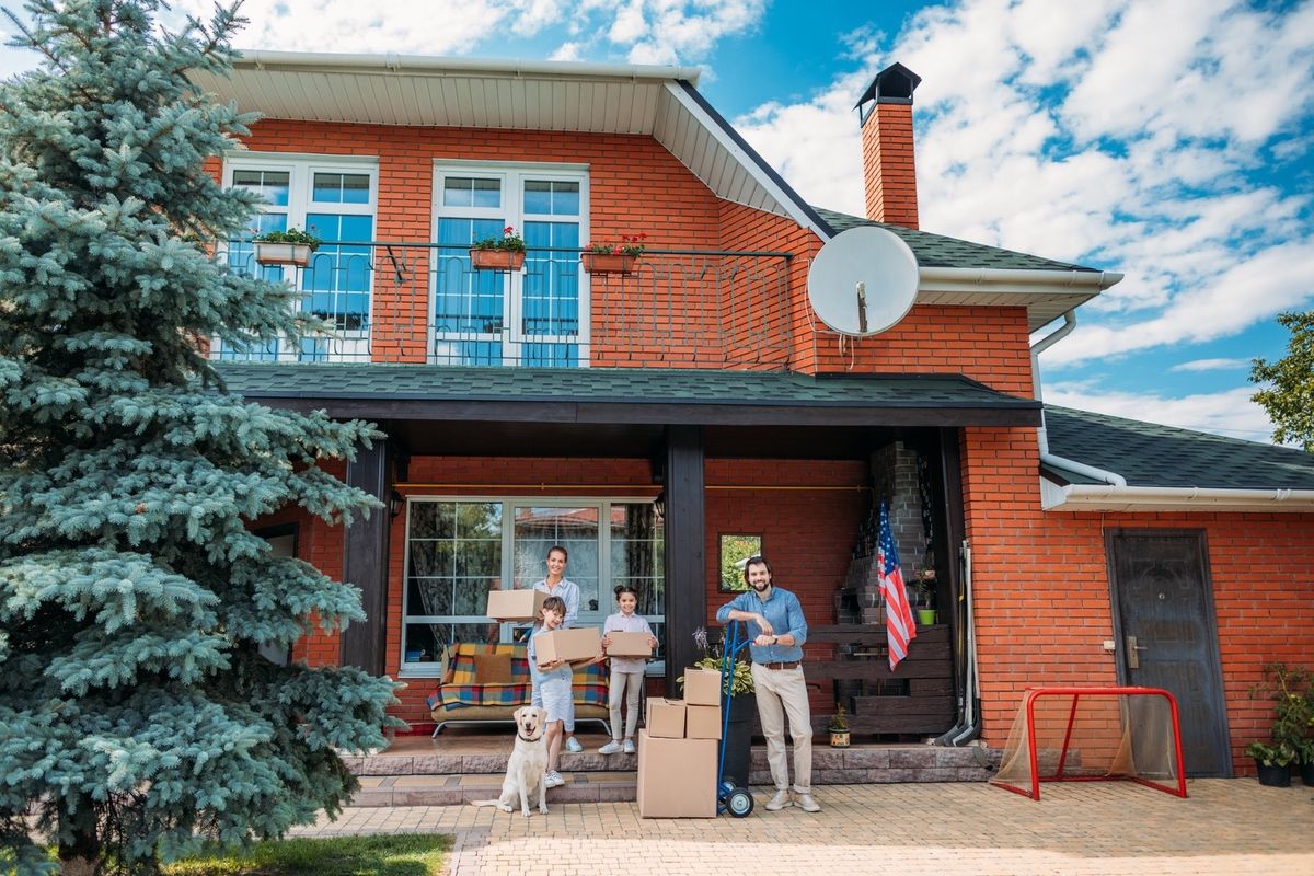 Family moving into a new Colorado home with their dog.