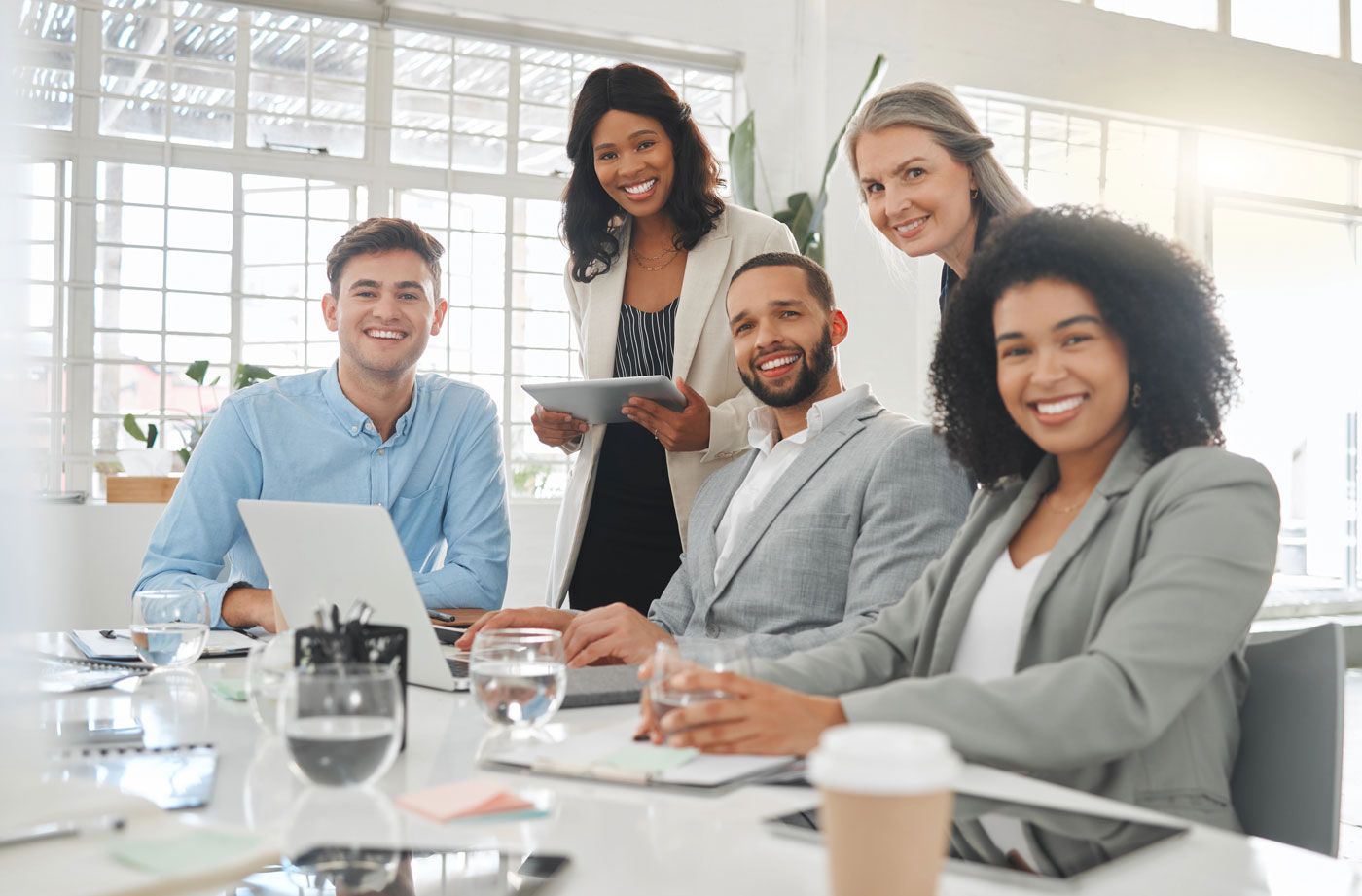 Mortgage advisory team collaborating around a table.