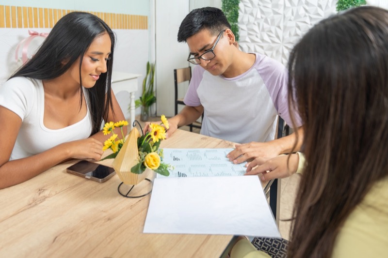 Homeowners filling out HELOC application information